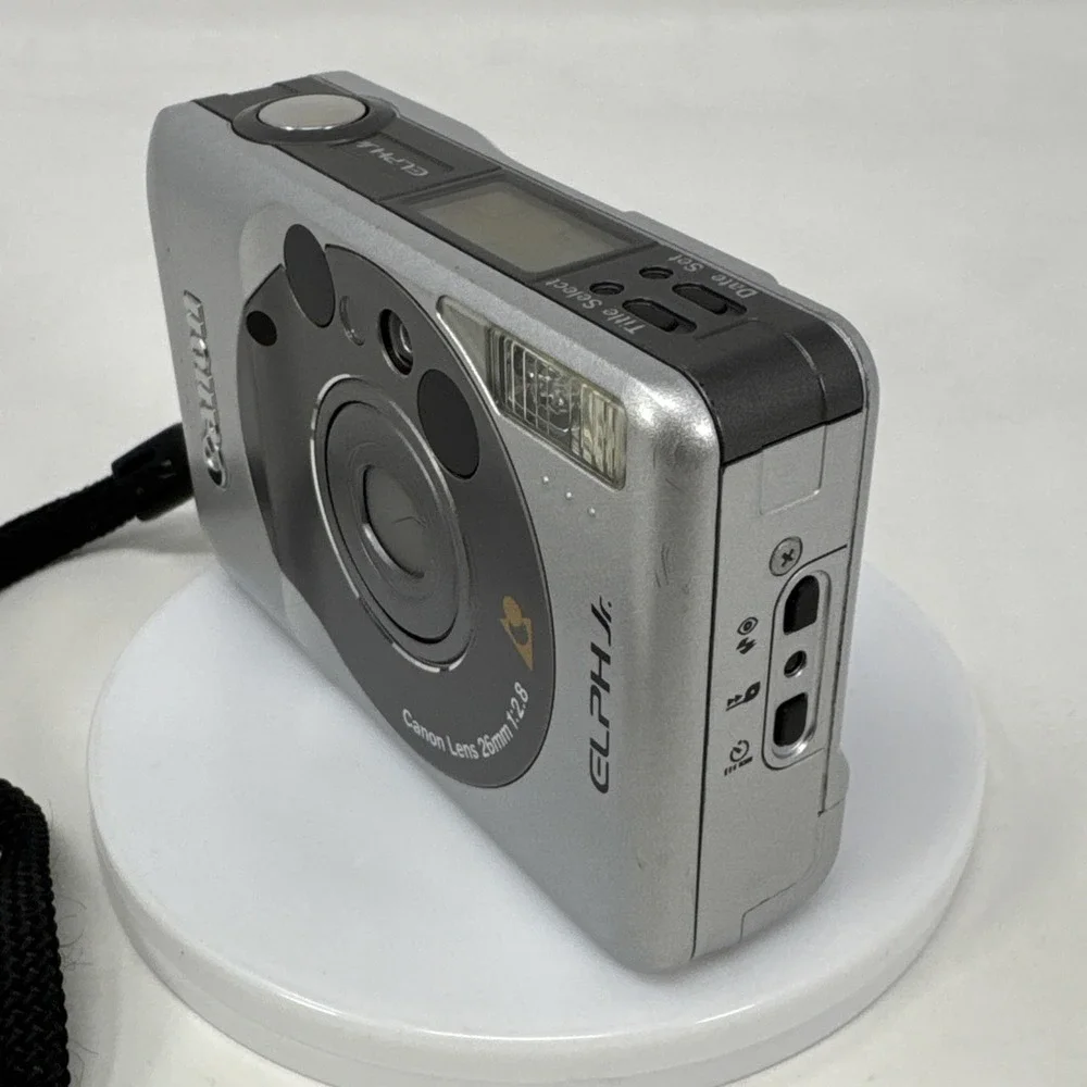 CANON Elph Jr. APS Film Camera, 26mm‎ f2.8 Wide Angle Lens, Silver w/ Case WORKS